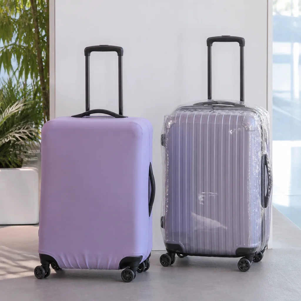 side by side comparison of a stretchy fabric suitcase cover and a transparent pvc suitcase cover
